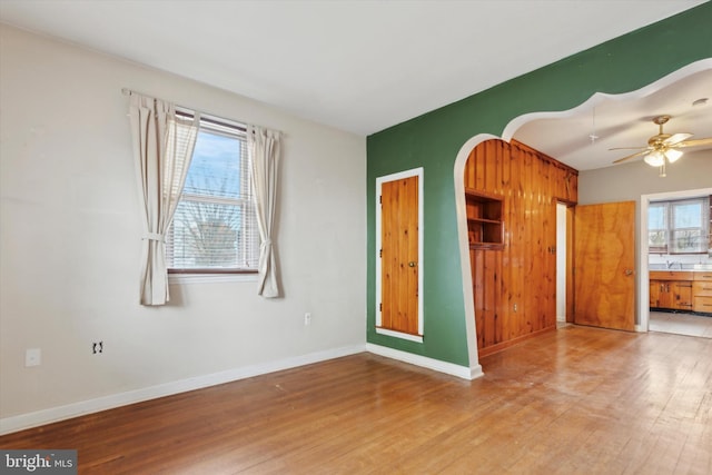 empty room featuring ceiling fan and wood-type flooring