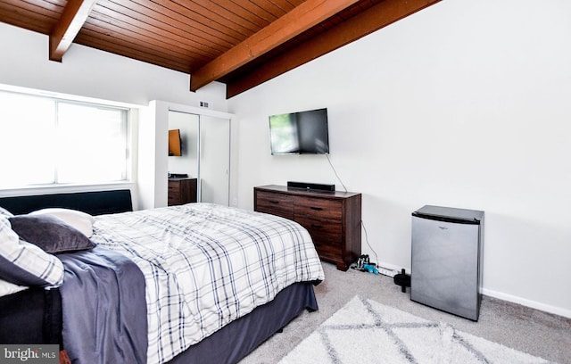 bedroom featuring light carpet, vaulted ceiling with beams, stainless steel refrigerator, and wood ceiling