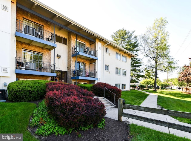 view of building exterior with central AC unit