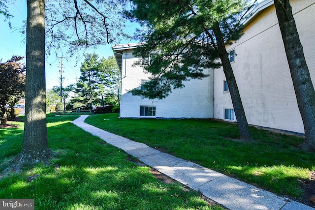 exterior space with a lawn