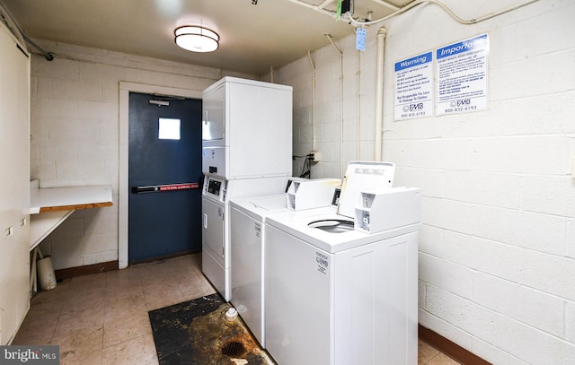 laundry room featuring stacked washer / drying machine and washer and dryer