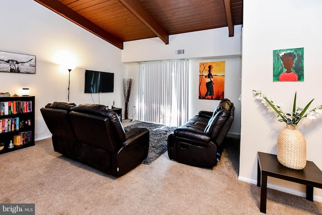 living room featuring lofted ceiling with beams, light colored carpet, and wooden ceiling