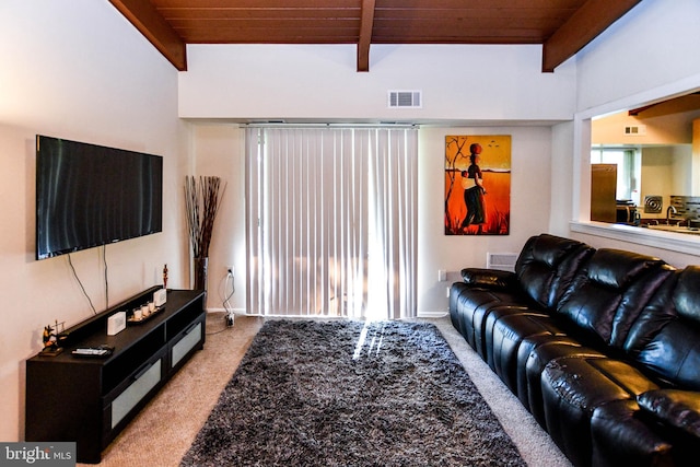 carpeted living room with beam ceiling and wood ceiling