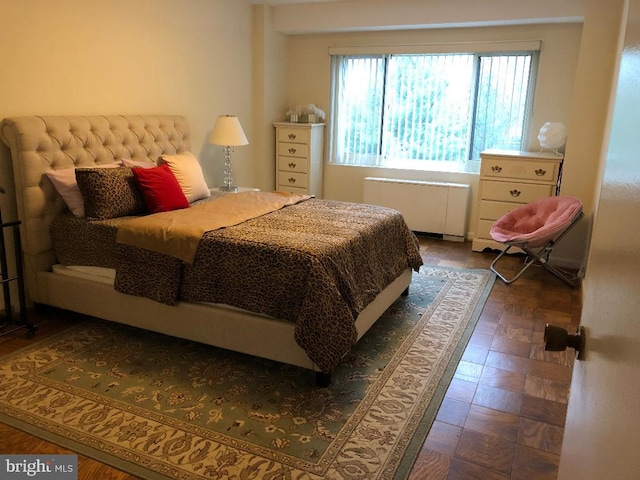 bedroom with radiator heating unit