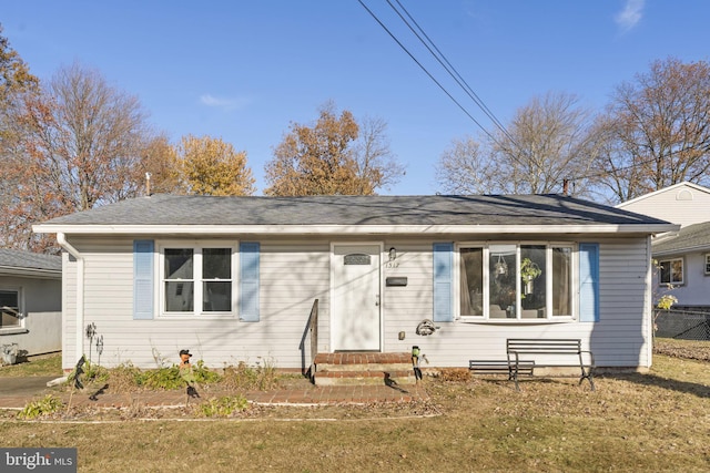 view of front of home featuring entry steps and roof with shingles