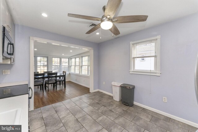 tiled dining space featuring ceiling fan, recessed lighting, and baseboards