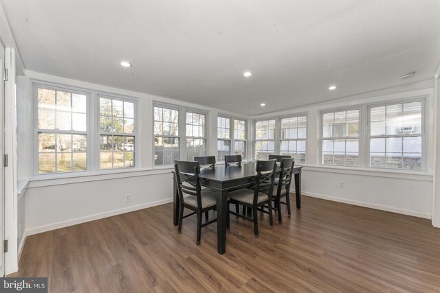 dining space featuring plenty of natural light, baseboards, dark wood finished floors, and recessed lighting