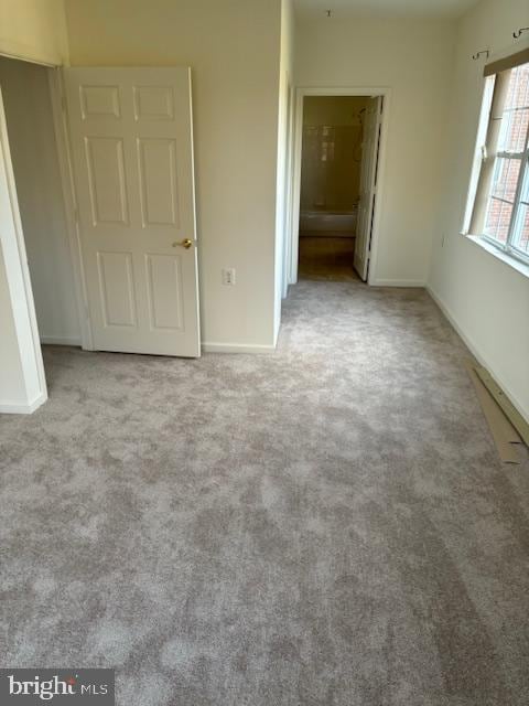 spare room with light colored carpet