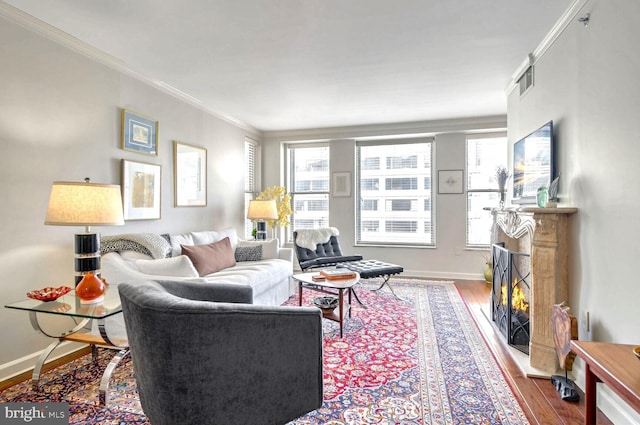 living room featuring crown molding and hardwood / wood-style floors