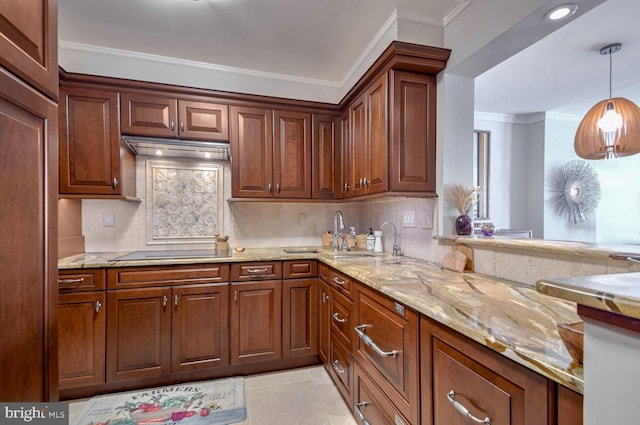 kitchen featuring black electric cooktop, crown molding, sink, decorative light fixtures, and light tile patterned flooring