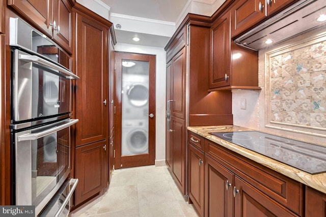 601 Pennsylvania Ave NW Unit 1003N, Washington, DC 20004 - washroom with washer / clothes dryer and ornamental molding