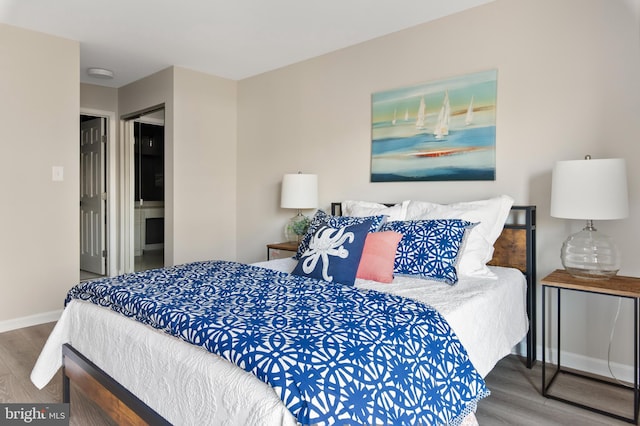 bedroom featuring hardwood / wood-style flooring