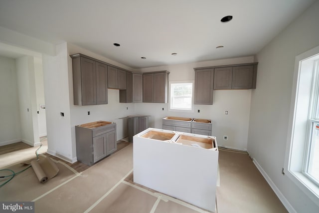 kitchen featuring gray cabinetry and a center island