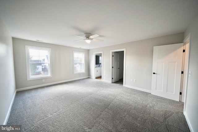 unfurnished bedroom featuring ceiling fan and light carpet