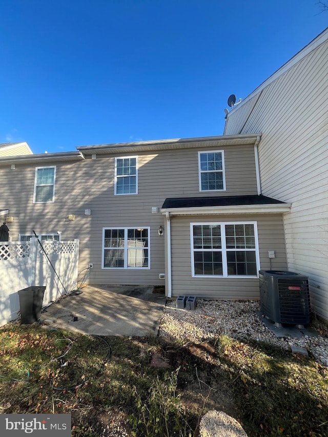 back of property featuring central AC and a patio area