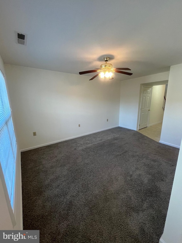 spare room with ceiling fan and carpet floors