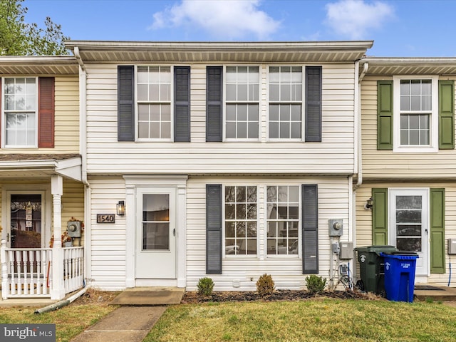 view of property with a front lawn