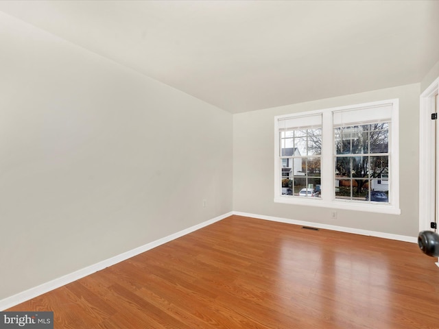 unfurnished room featuring wood-type flooring