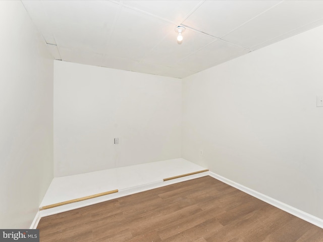 spare room with hardwood / wood-style floors