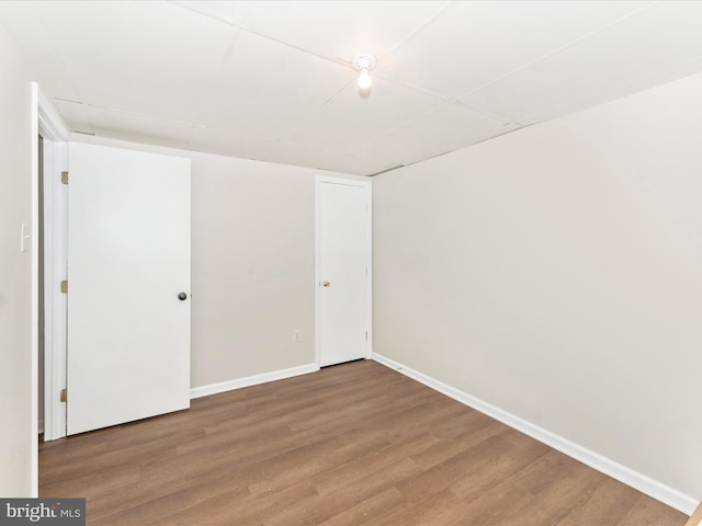 unfurnished room featuring hardwood / wood-style flooring