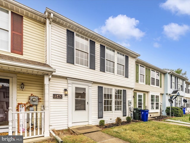 view of property with a front lawn