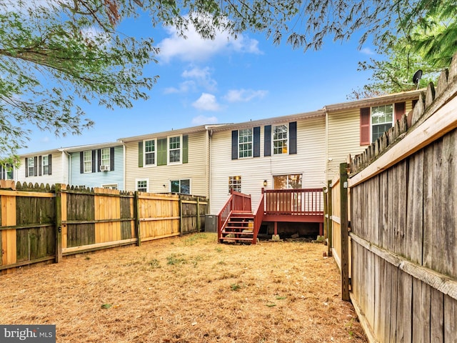 back of property featuring a deck and central air condition unit