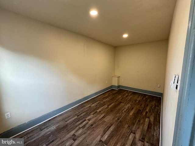 spare room featuring dark hardwood / wood-style floors