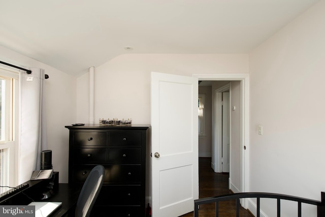 office with dark hardwood / wood-style flooring and vaulted ceiling