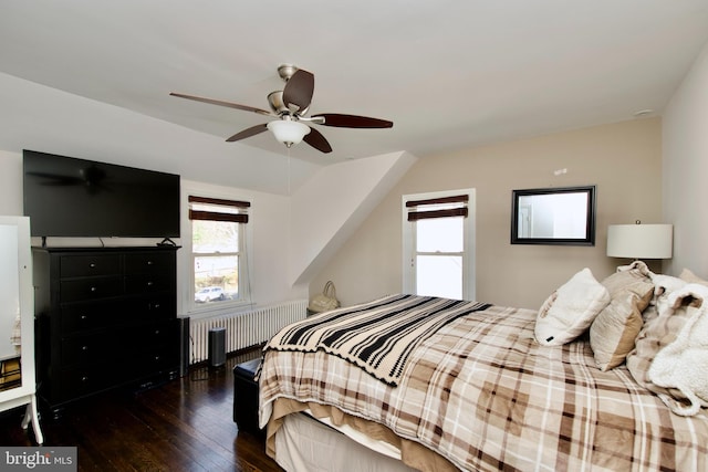 bedroom with radiator, ceiling fan, and dark hardwood / wood-style floors