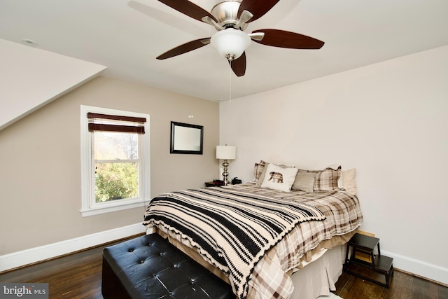 bedroom with ceiling fan and dark wood-type flooring