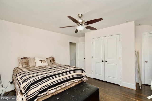 bedroom with a closet, dark hardwood / wood-style floors, and ceiling fan