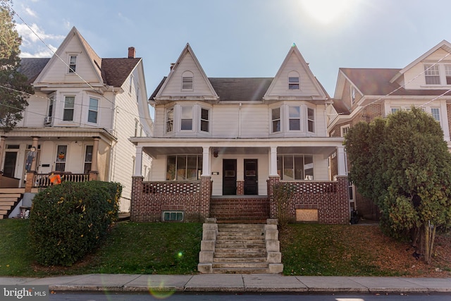 victorian-style house with a porch