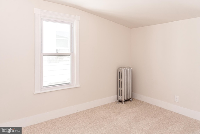 bonus room featuring carpet flooring, lofted ceiling, and radiator