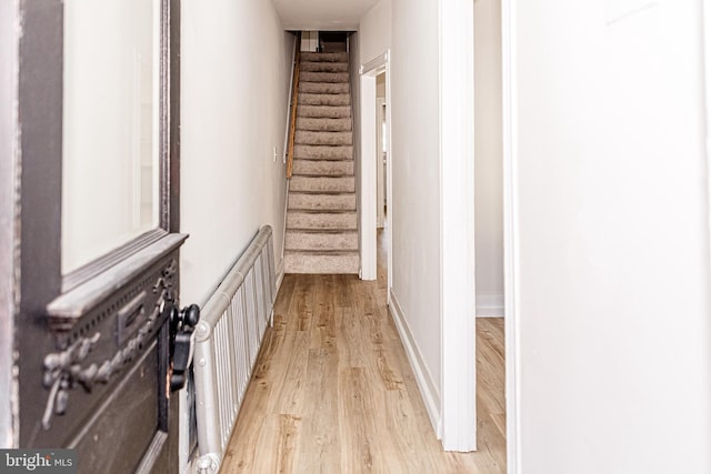 hall with light wood-type flooring