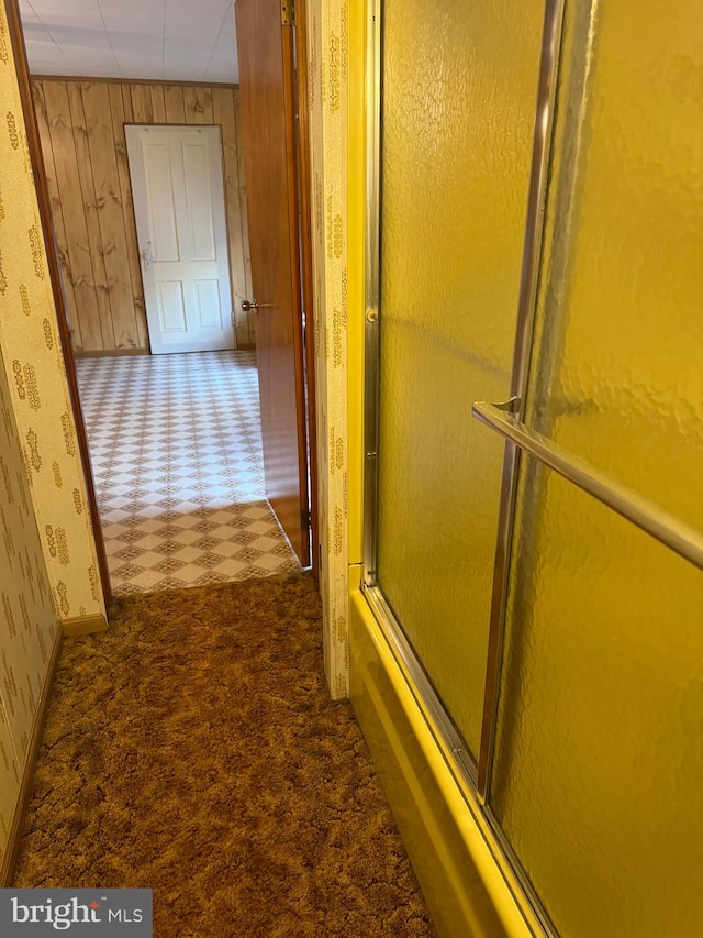 hallway with wooden walls