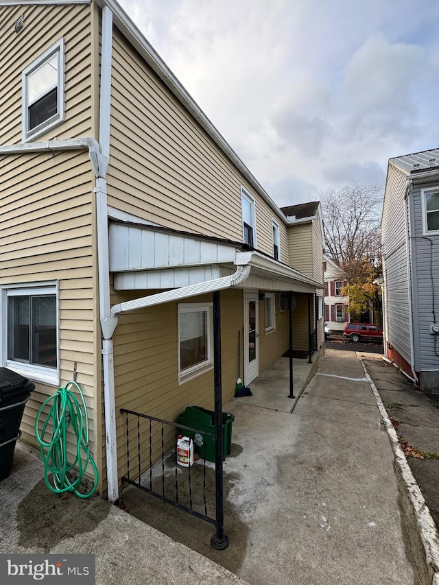 view of side of home with a patio