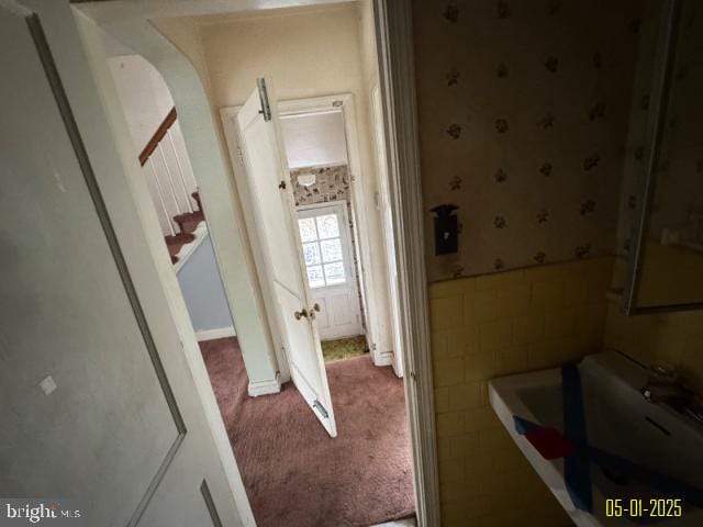 6410 Laurel Dr, Gwynn Oak, MD 21207 - corridor with wallpapered walls, carpet floors, and a wainscoted wall