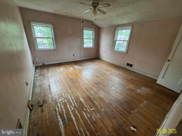 6410 Laurel Dr, Gwynn Oak, MD 21207 - unfurnished bedroom featuring vaulted ceiling, hardwood / wood-style floors, and baseboards