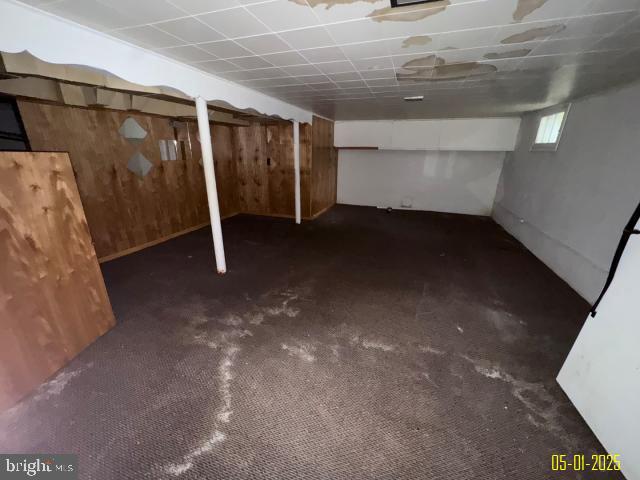 6410 Laurel Dr, Gwynn Oak, MD 21207 - basement featuring carpet floors and wooden walls