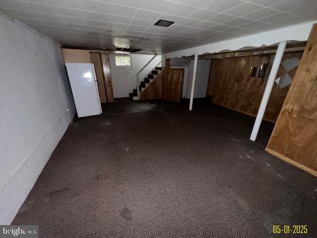 6410 Laurel Dr, Gwynn Oak, MD 21207 - basement featuring stairway and dark colored carpet