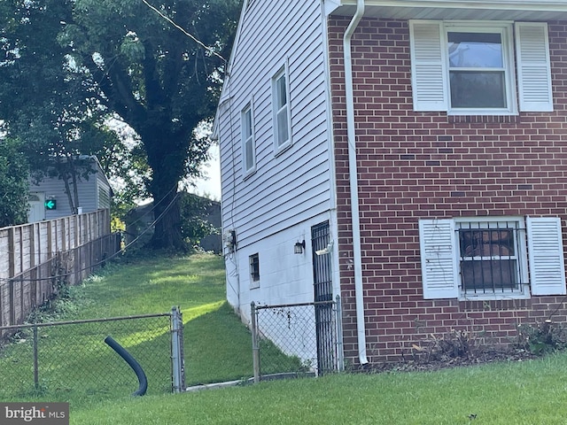 view of home's exterior featuring a yard