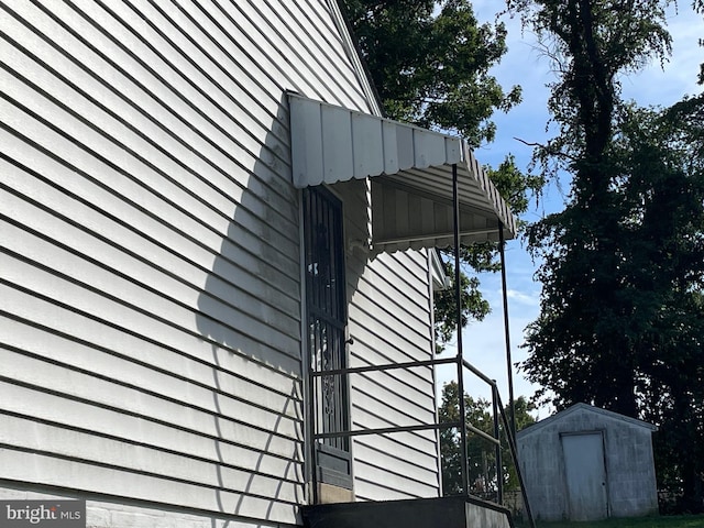 view of property exterior with a storage shed