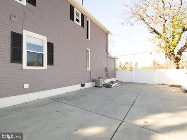 view of side of property with a patio area