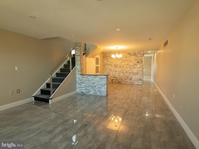 interior space featuring dark hardwood / wood-style floors and an inviting chandelier