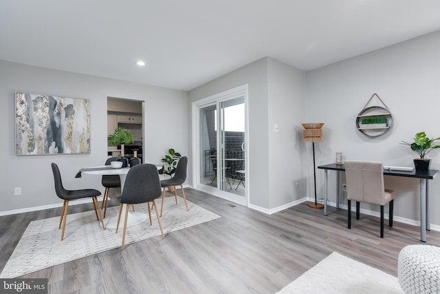 dining area featuring hardwood / wood-style flooring