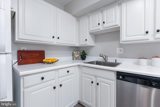 kitchen featuring white cabinetry, dishwasher, and sink