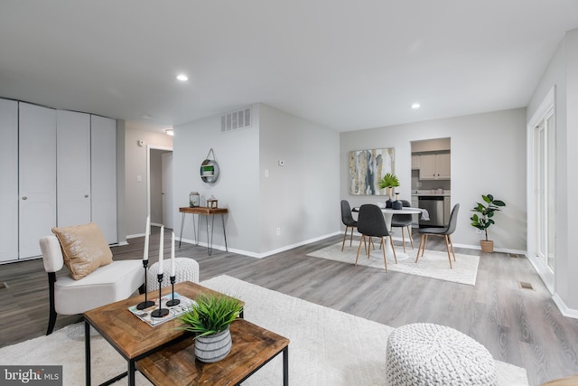 living room with light hardwood / wood-style floors