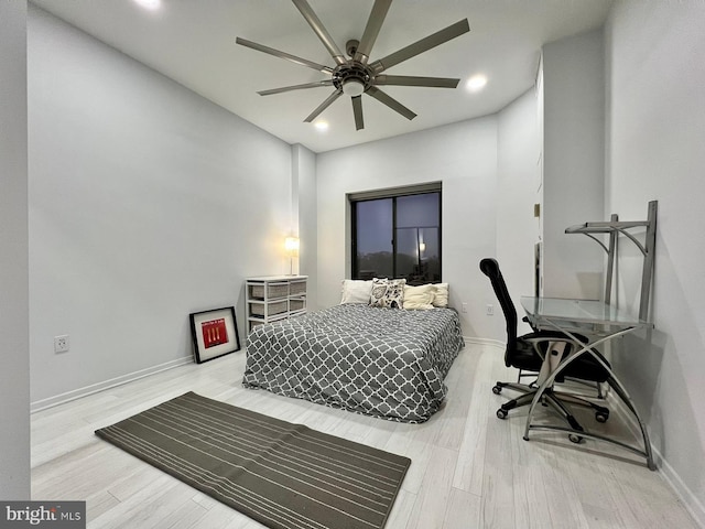 bedroom featuring ceiling fan and wood-type flooring