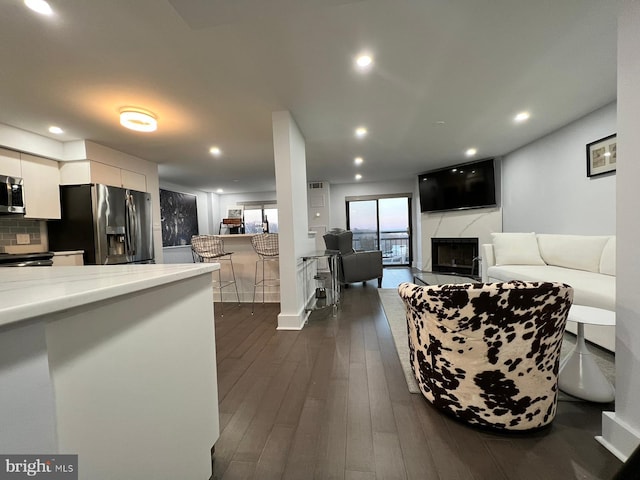 living room featuring dark wood-type flooring