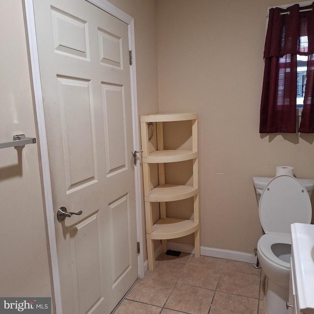 bathroom featuring tile patterned floors and toilet